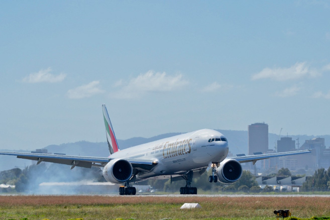 An Emirates Boeing 777-300ER  lands in Adelaide