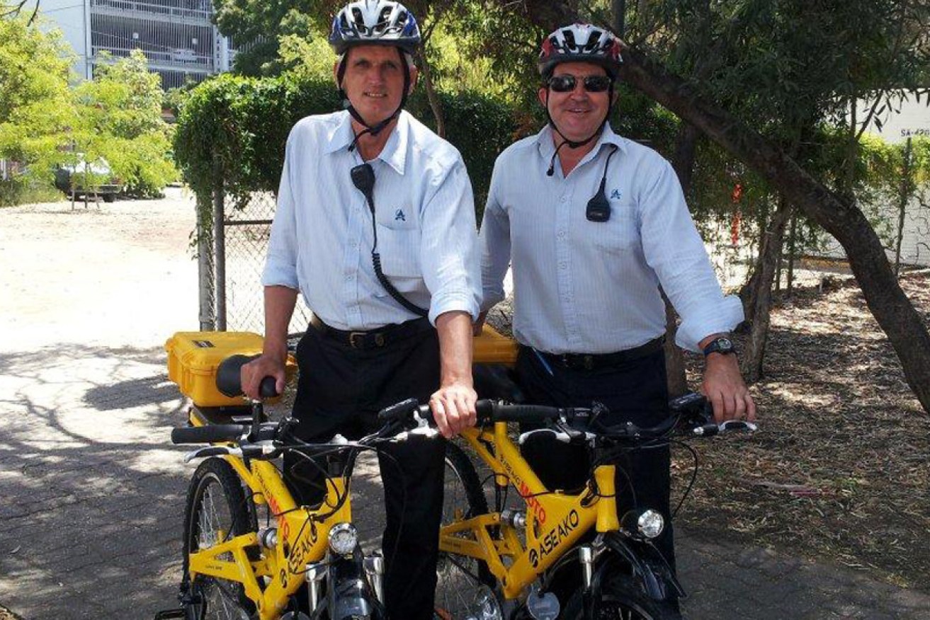 Adelaide City Council parking and information officers with electric bikes they are trialling.