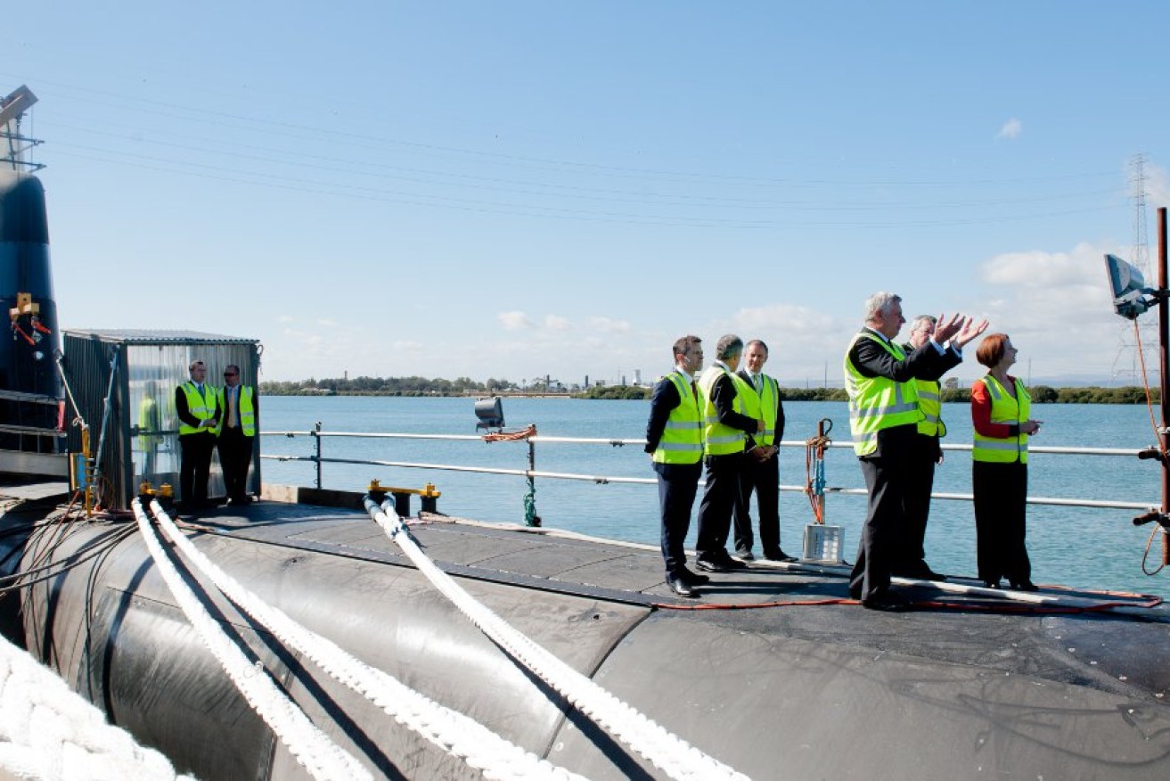 Then Prime Minister Julia Gillard, and State Premier Jay Weatherill inspect a Collins Class submarine at ASC in Osborne. Photo: Nat Rogers/InDaily