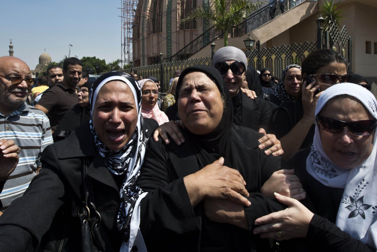 Mourning relatives of the four policemen killed during clashes with Muslim Brotherhood supporters earlier in the week.