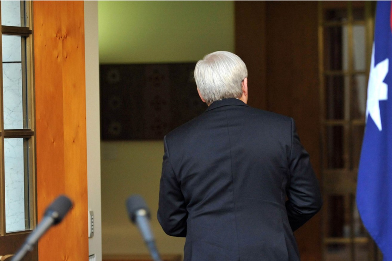 Kevin Rudd leaves the Prime Ministerial courtyard after announcing the election date yesterday.