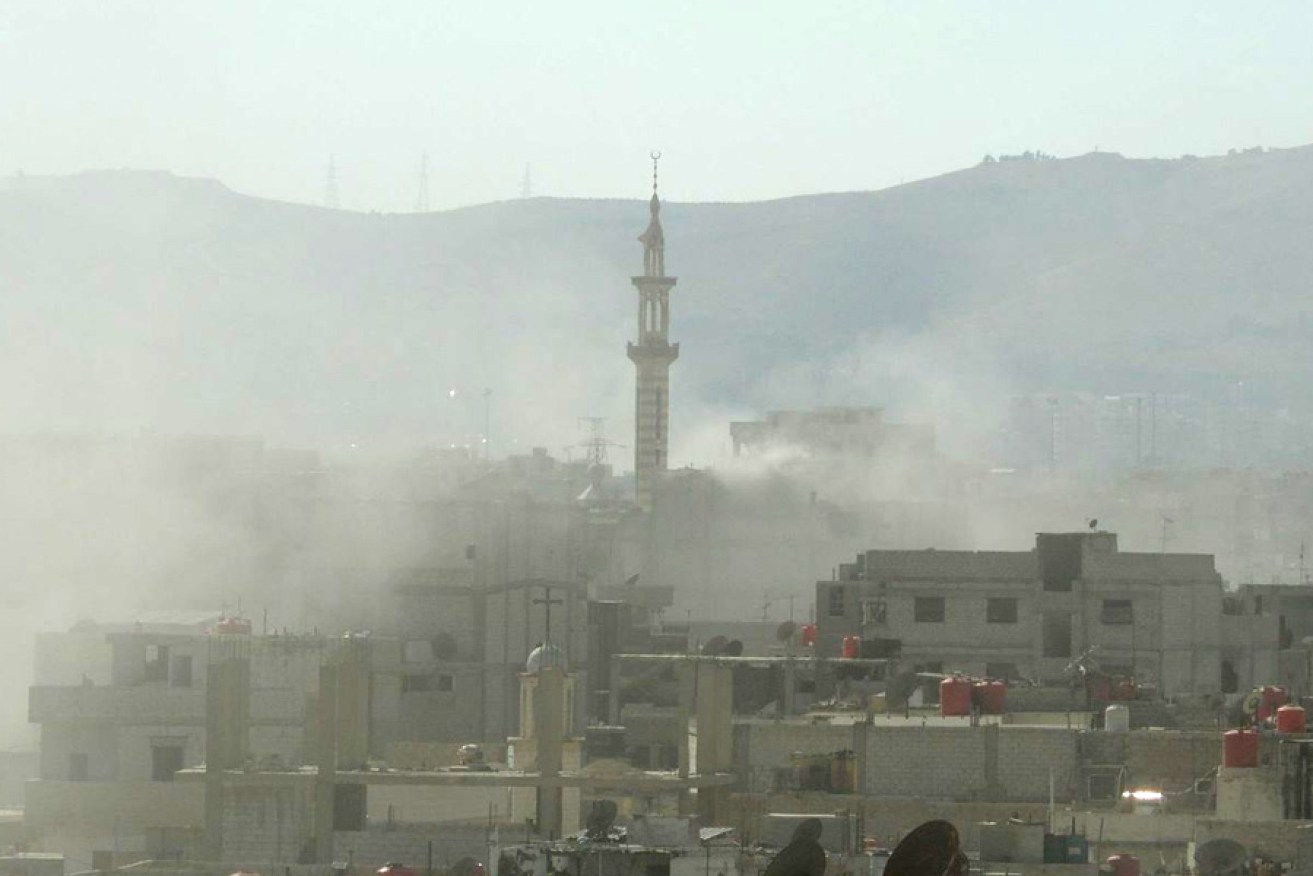 A handout image released by the Syrian opposition's Shaam News Network shows smoke above buildings following what Syrian rebels claim to be a toxic gas attack by pro-government forces in eastern Ghouta, on the outskirts of Damascus.