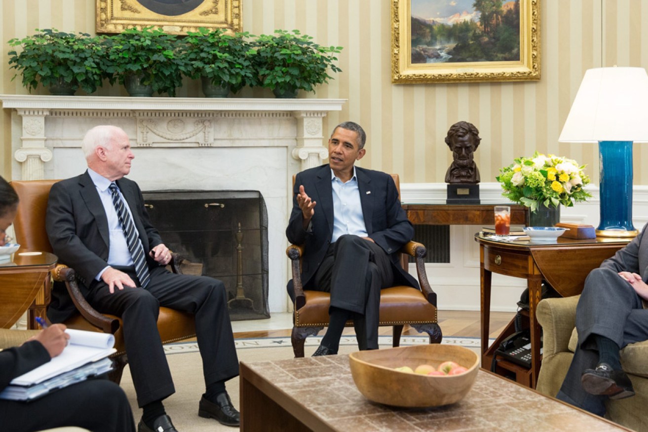US President Barack Obama and National Security Advisor Susan Rice during a meeting on the Syrian crisis with Senators John McCain (second from left) and Lindsey Graham (right) in the Oval Office.