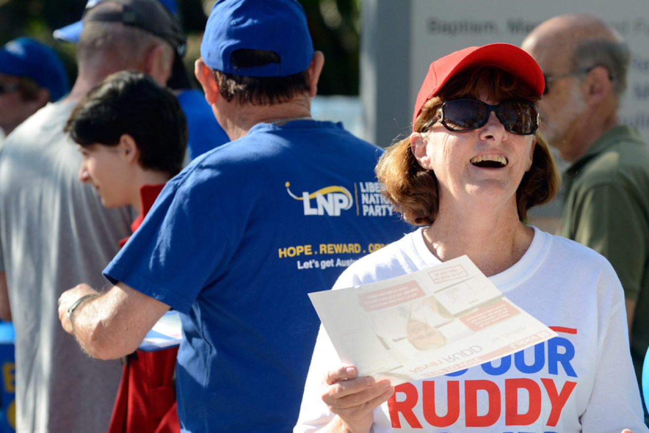 Volunteers handing out 'how to vote' cards in Kevin Rudd's Brisbane seat of Griffith.