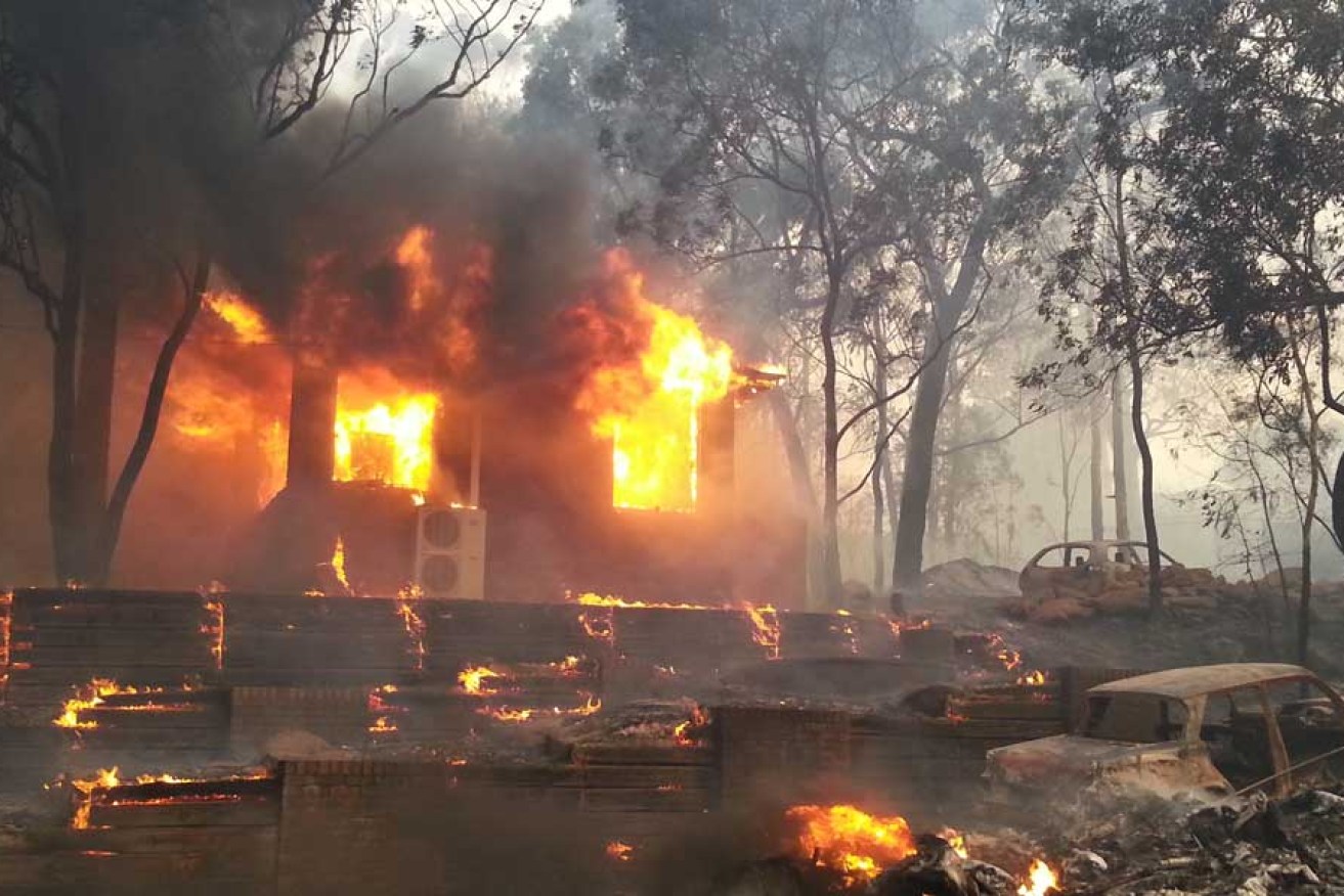 A house is engulfed in flames from bushfires in Yellow Rock, in the Blue Mountains, last week. 