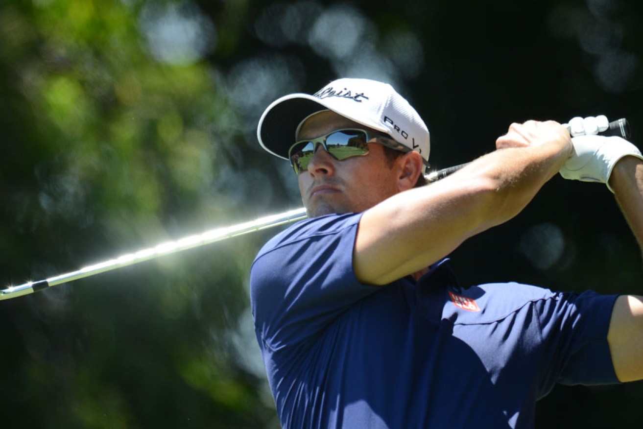 Australian golfer Adam Scott in action during his record-breaking first round of the Australian Open Golf championship at the Royal Sydney Golf Club.