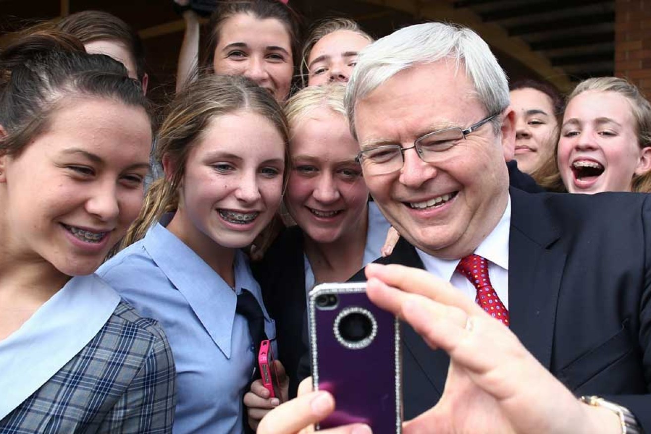 Then Prime Minister Kevin Rudd poses for a selfie with school students during the federal election campaign in September.