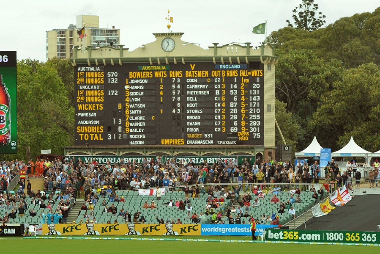 Adelaide Oval's historic scoreboard, next to the modern equivalent, on day five of the Ashes test this week.