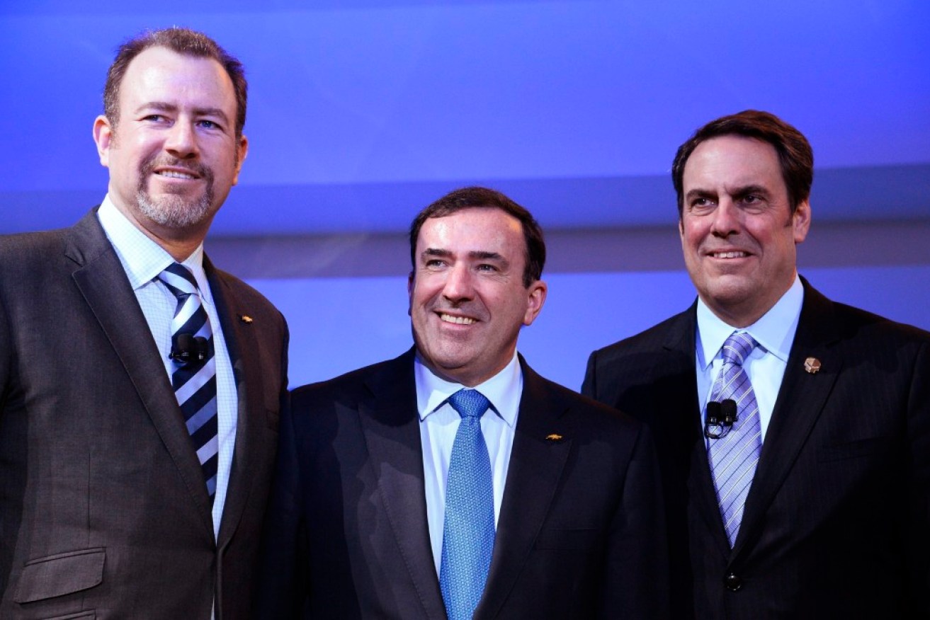 GM execs Mark Reuss (R), President General Motors North America, Alan Batey (C), Head of Sales North America, and Dan Ammann (L), 