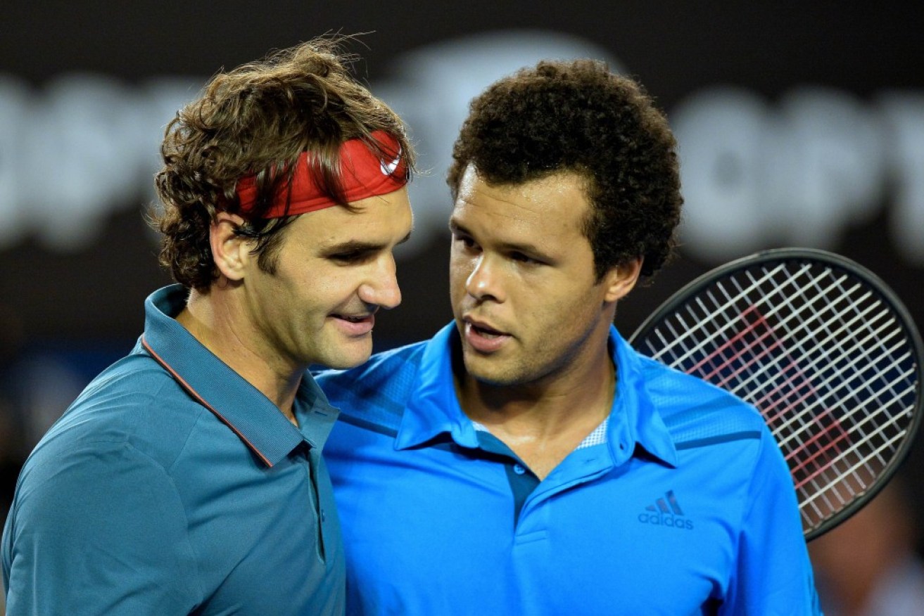 Federer (left) is all smiles after beating Tsonga