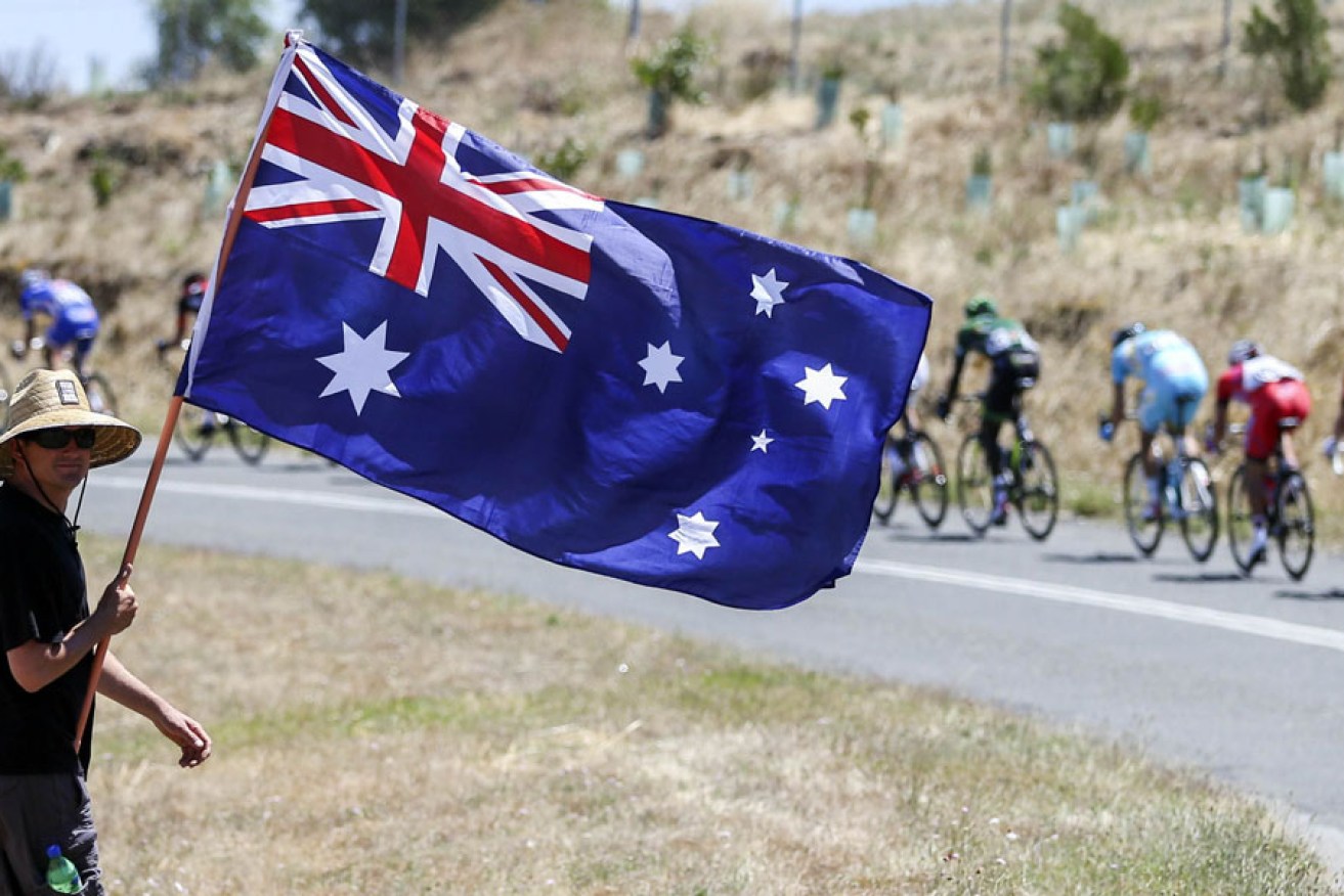 A fan waves an Australian flag during Friday's Tour Down Under.
