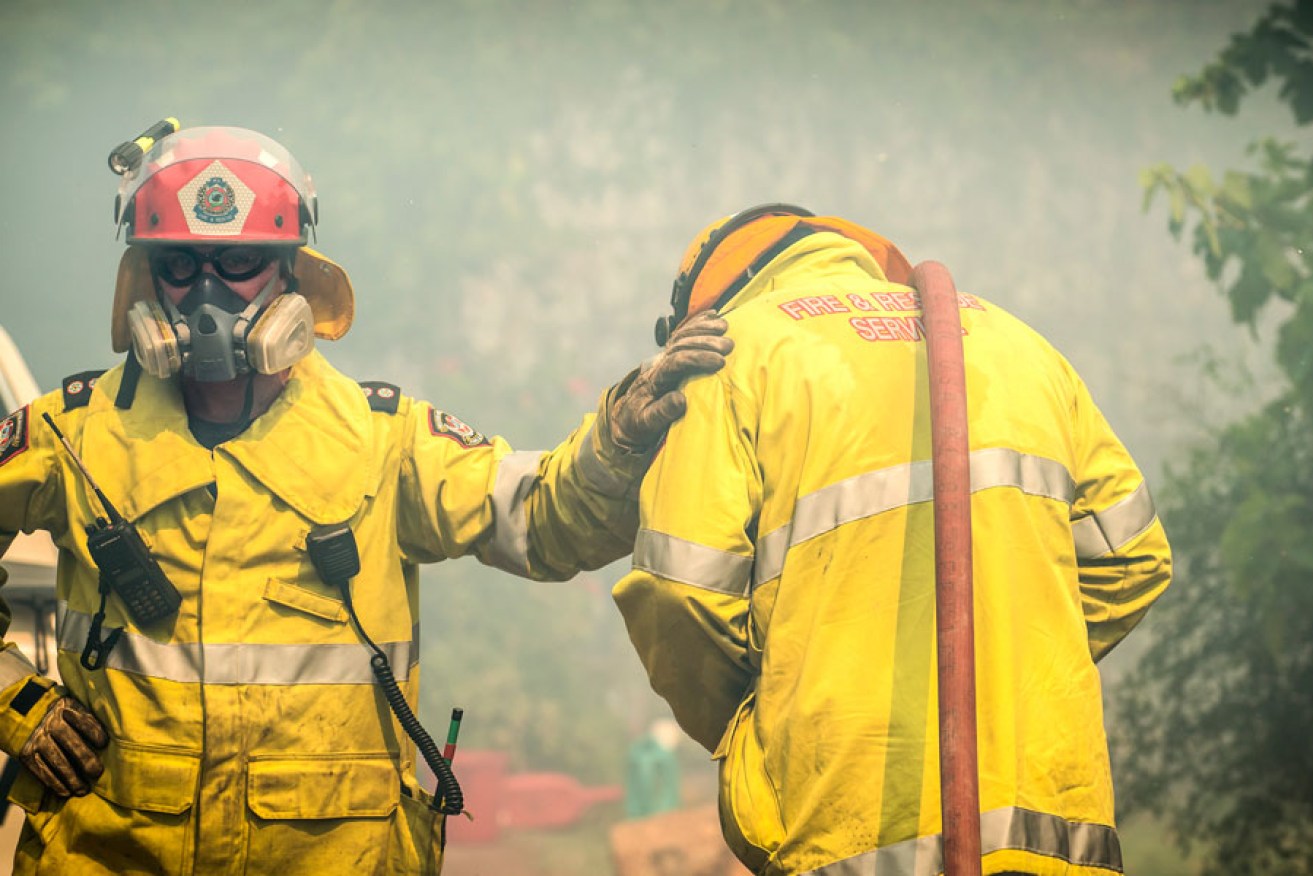 Firefighters in Perth, where extreme heat triggered bushfires that destroyed more than 50 properties.