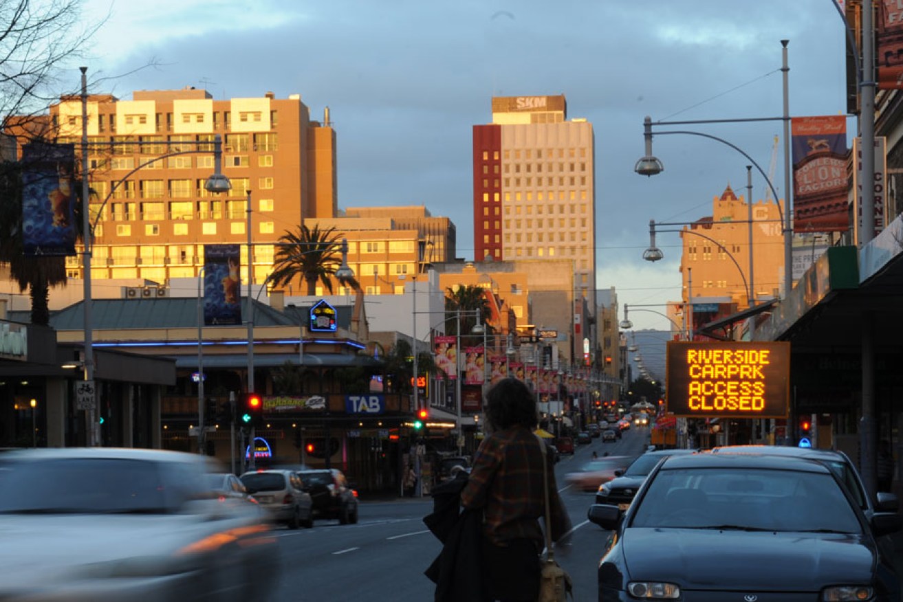 The sun goes down over Hindley Street. 