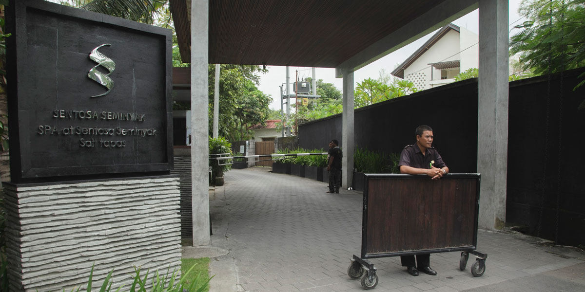 Security guards outside the Sentosa Seminyak Villa in Bali, where Schapelle Corby was reportedly taken after being granted parole.