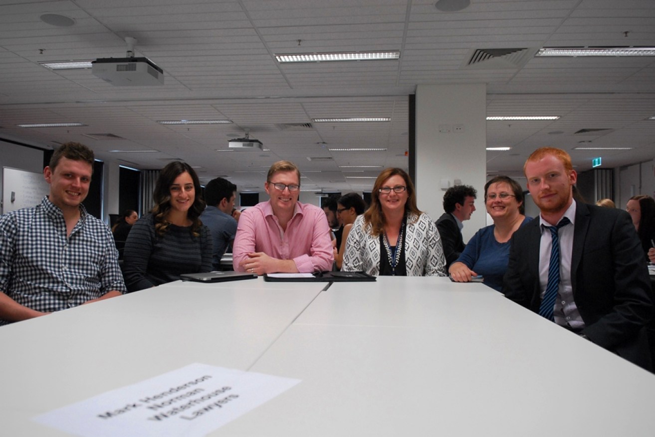Centre left, mentor Mark Henderson, from Norman Waterhouse Lawyers, with, centre right, Lucy Evans, Deputy Director of Professional Programs at Flinders University Law School, and Flinders law students. 