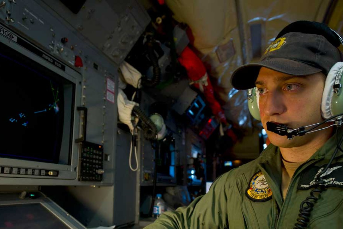 Royal Australian Air Force Airborne Electronics Analyst, Sergeant Ben Herbert, monitors his screens during the search for missing Malaysia Airlines flight MH370 off the coast of Western Australia.