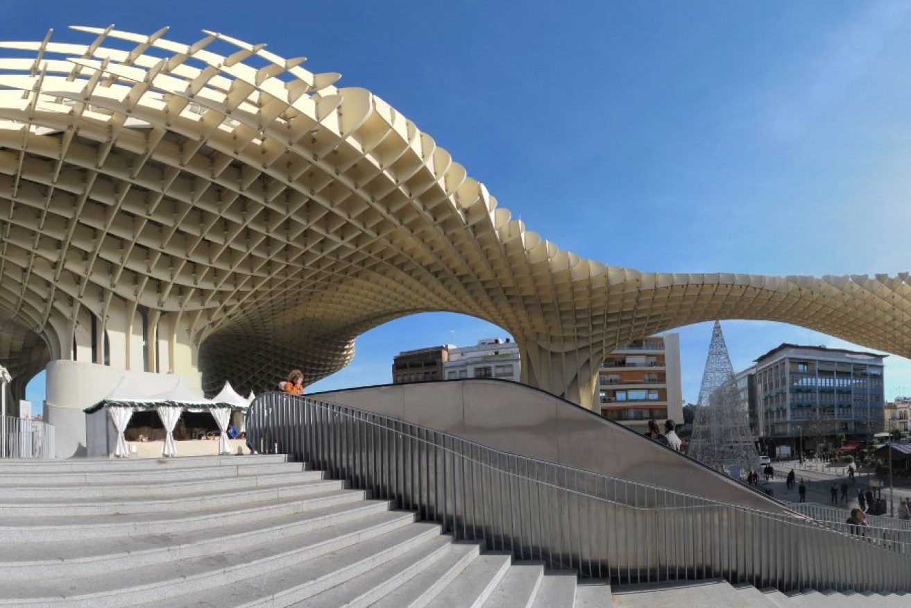 Metropol Parasol is a wooden building in the old quarter of Seville, Spain. It was designed by the German architect Jürgen Mayer-Hermann, and its construction finished in 2011. Photo: Rubendene