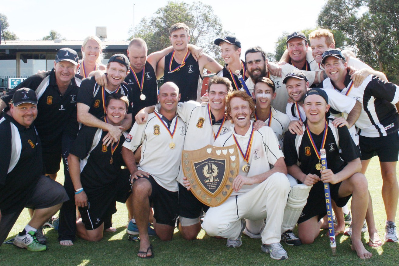 Peter Brien, second from the left, with the victorious Magpies. Image by Peter Argent.