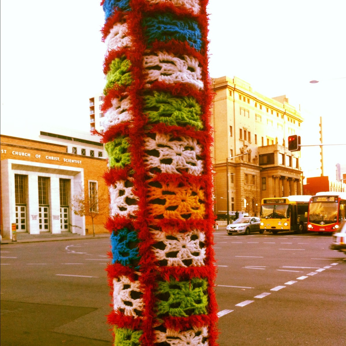 A yarn-bombed pole on North Terrace, Adelaide. 