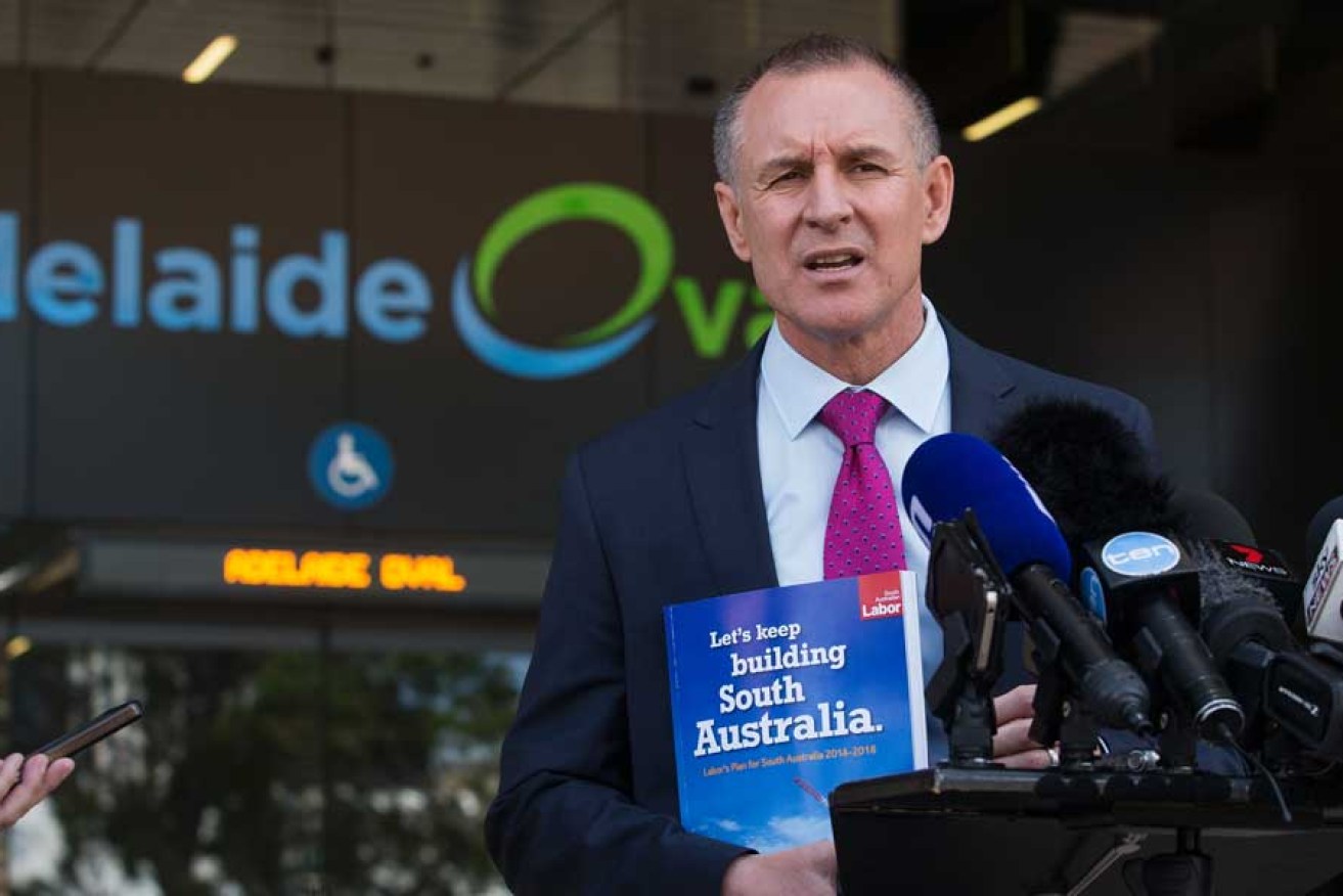 Jay Weatherill with his policy manifesto during the 2014 election campaign.