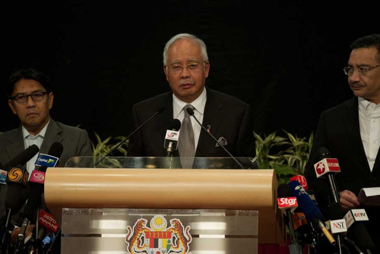 Malaysian Prime Minister Najib Razak (centre) announces that Malaysian Airlines flight MH370 ended in the southern Indian Ocean.