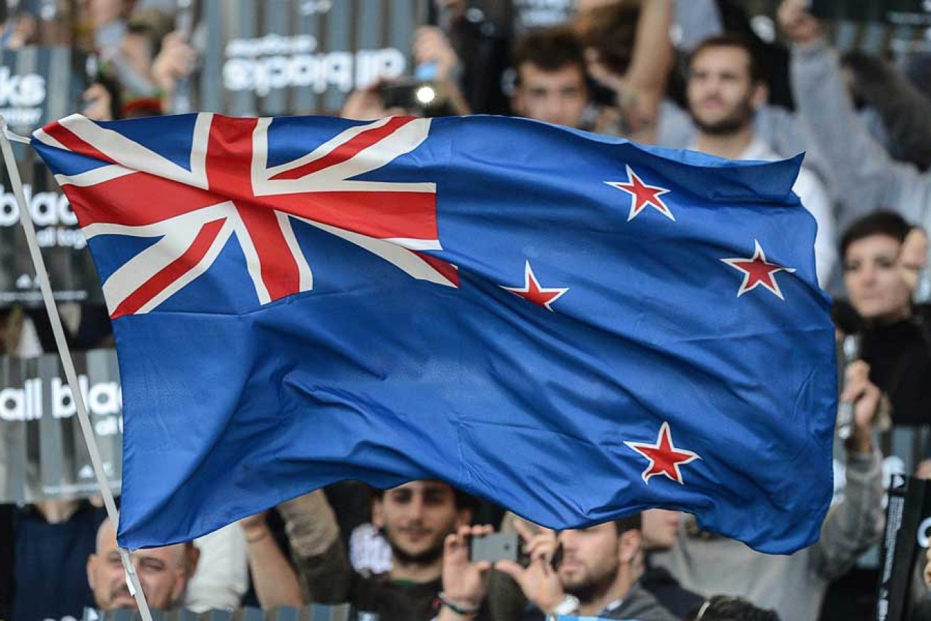 Flying the New Zealand flag at an All Blacks rugby match.