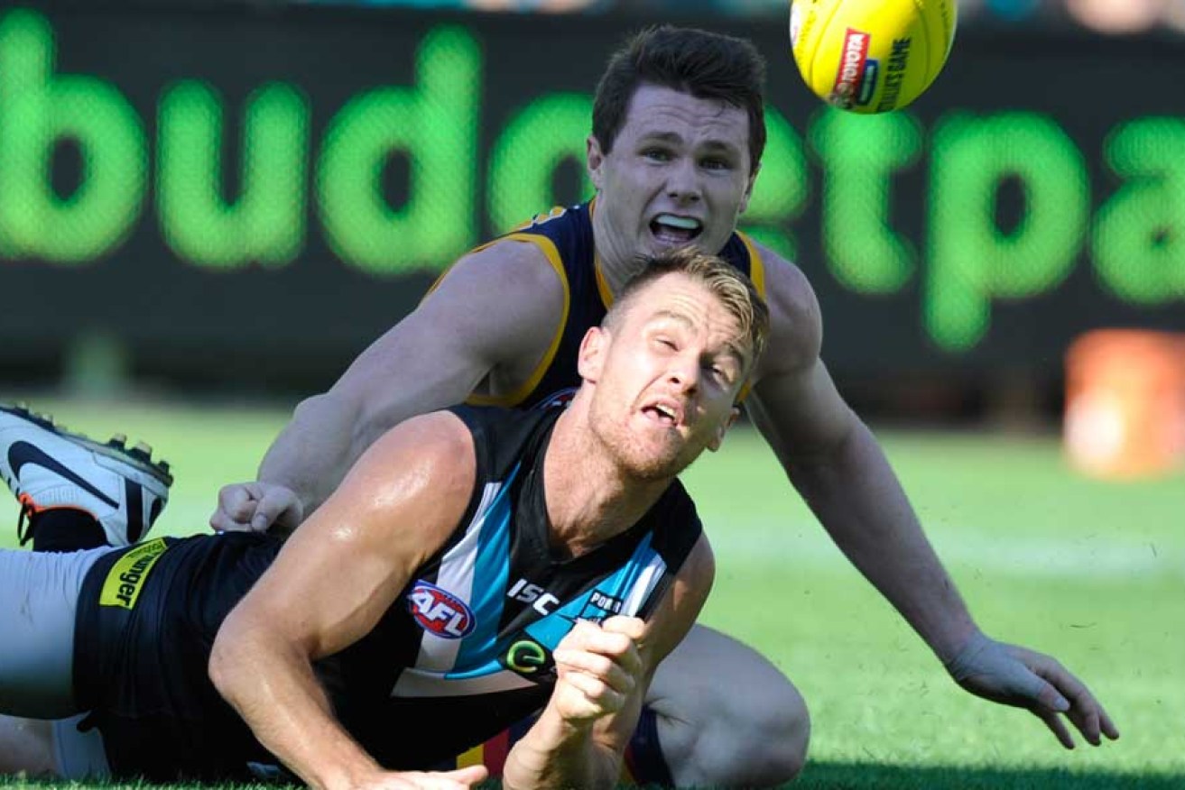 Port's Robbie Gray beats Adelaide's Patrick Dangerfield to the ball. Image; AAP