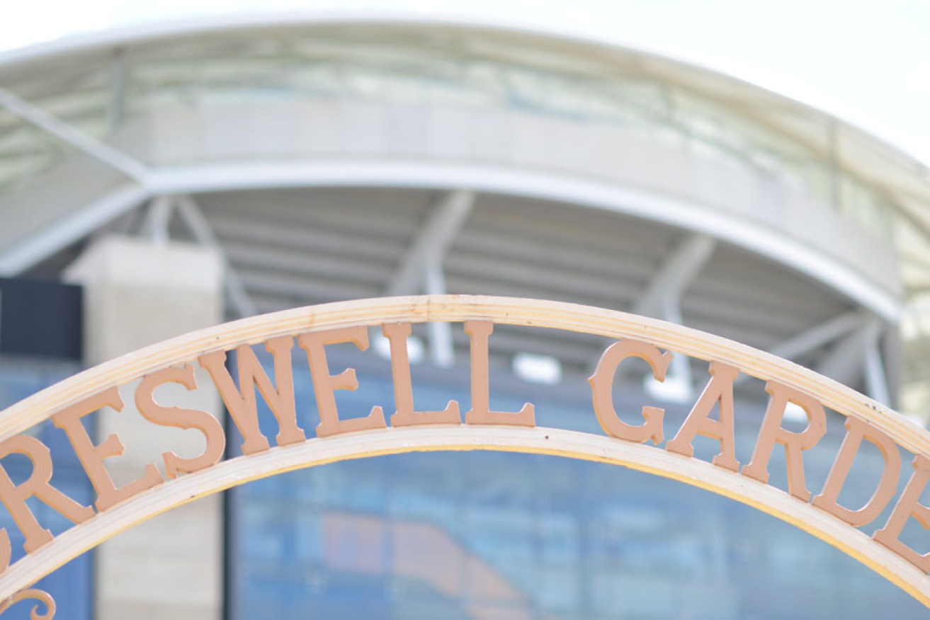 Adelaide Oval looms behind the Creswell Garden gate. Photo: Nat Rogers/InDaily