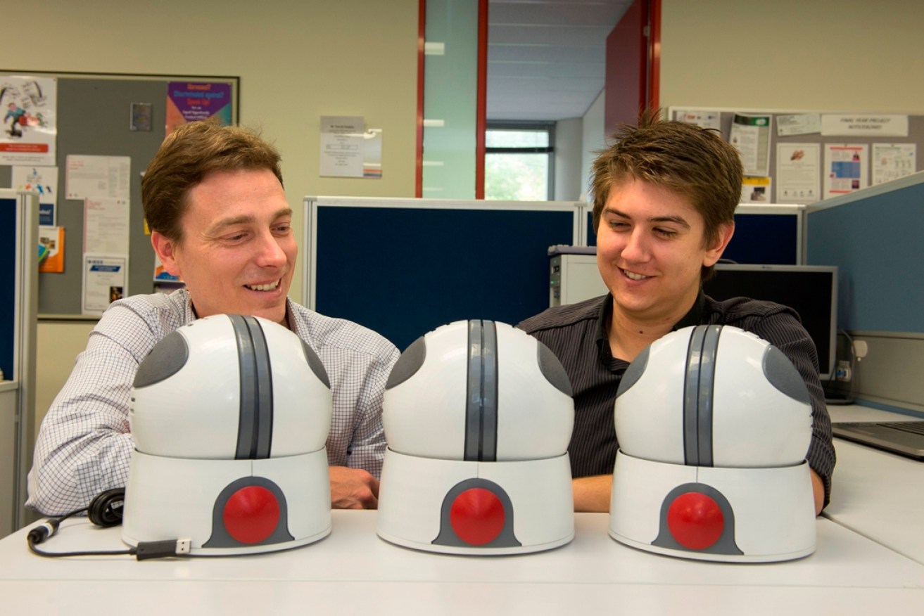 Mr David Hobbs (right) and Mr Max Hughes with prototypes of game controller 'Orby'