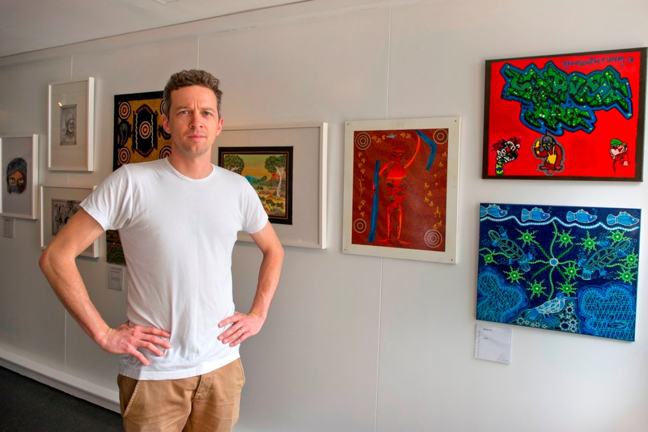 Jeremy Ryder with entries in the Art by Prisoners exhibition