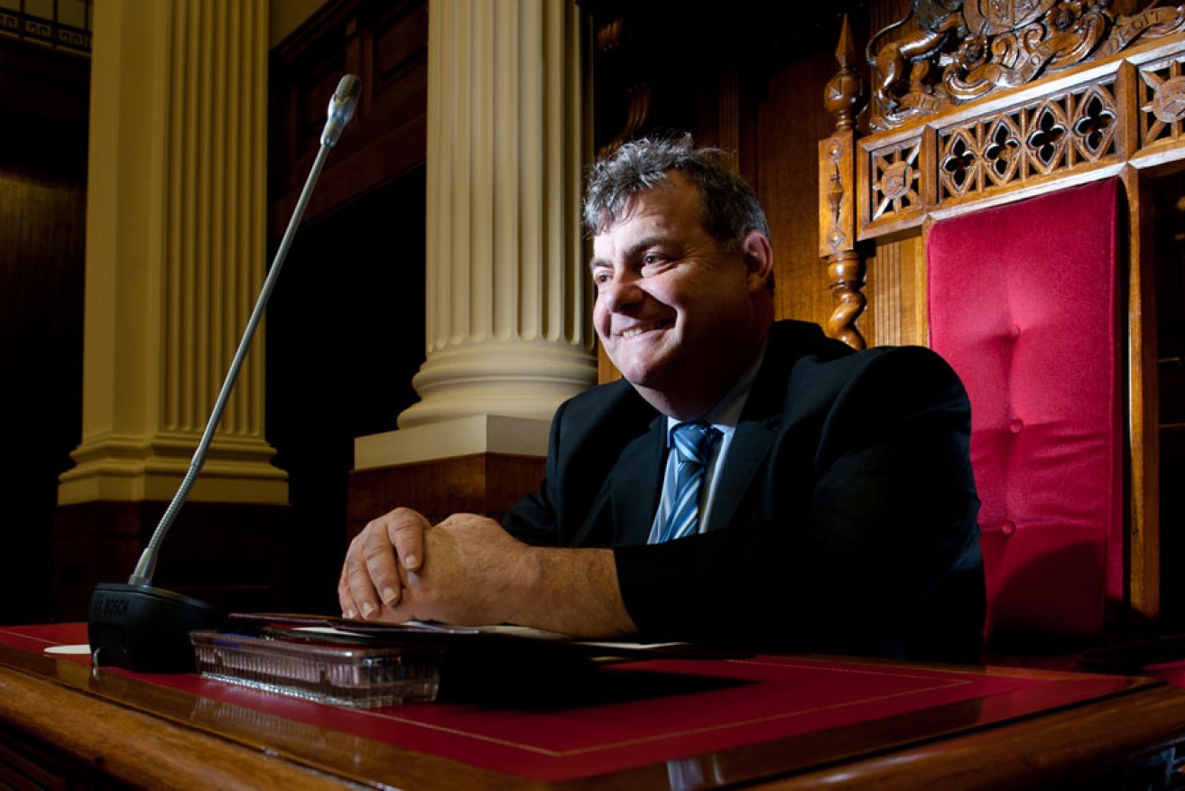 John Gazzola in happier days, siting in the president's chair. Photo: Nat Rogers/InDaily