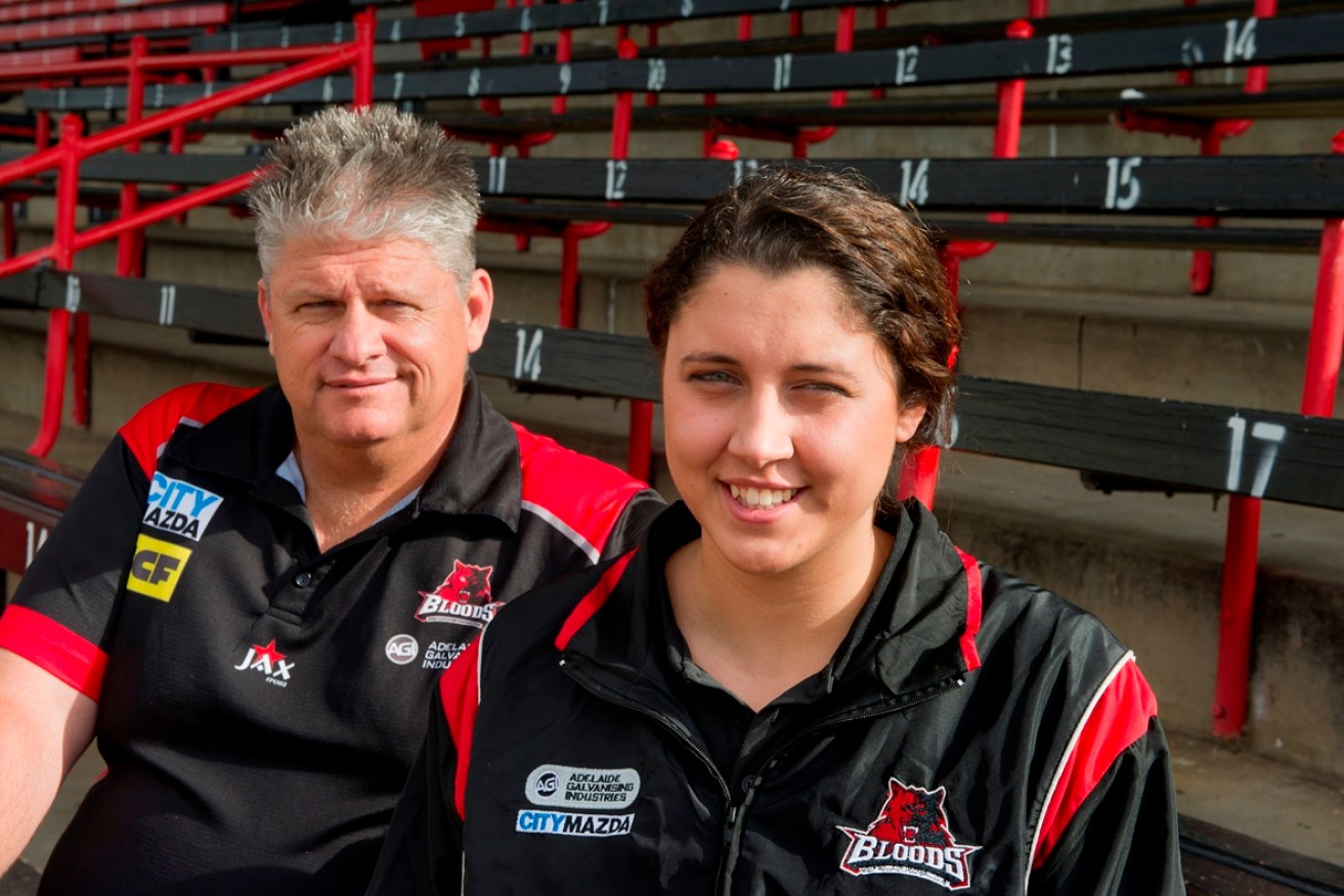 Stephanie Walker with West Adelaide's football manager, Mr Andrew Marks