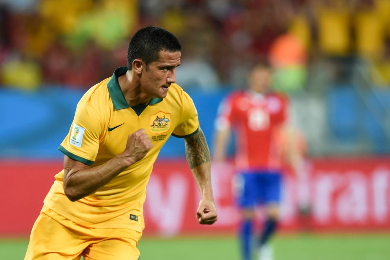 Tim Cahill celebrates his goal against Chile. AAP image
