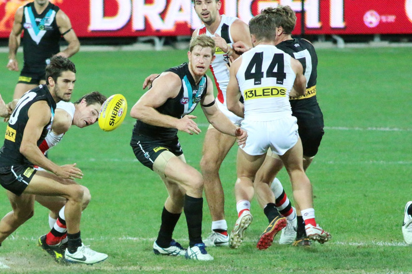 The ball comes loose, and Wingard is the first on to it. Photo: Peter Argent
