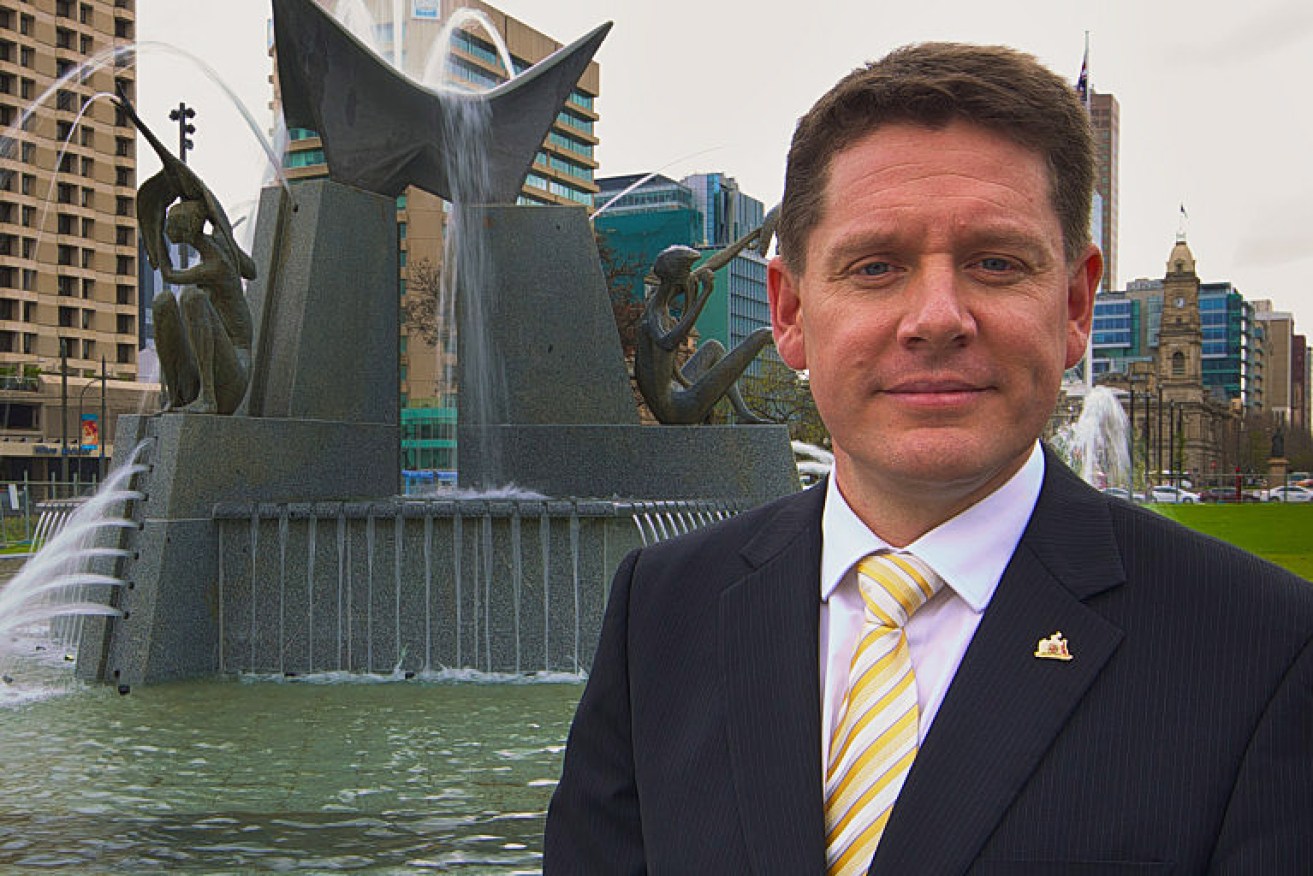 Former Lord Mayor Stephen Yarwood in front of the reconstructed Three Rivers Fountain. 