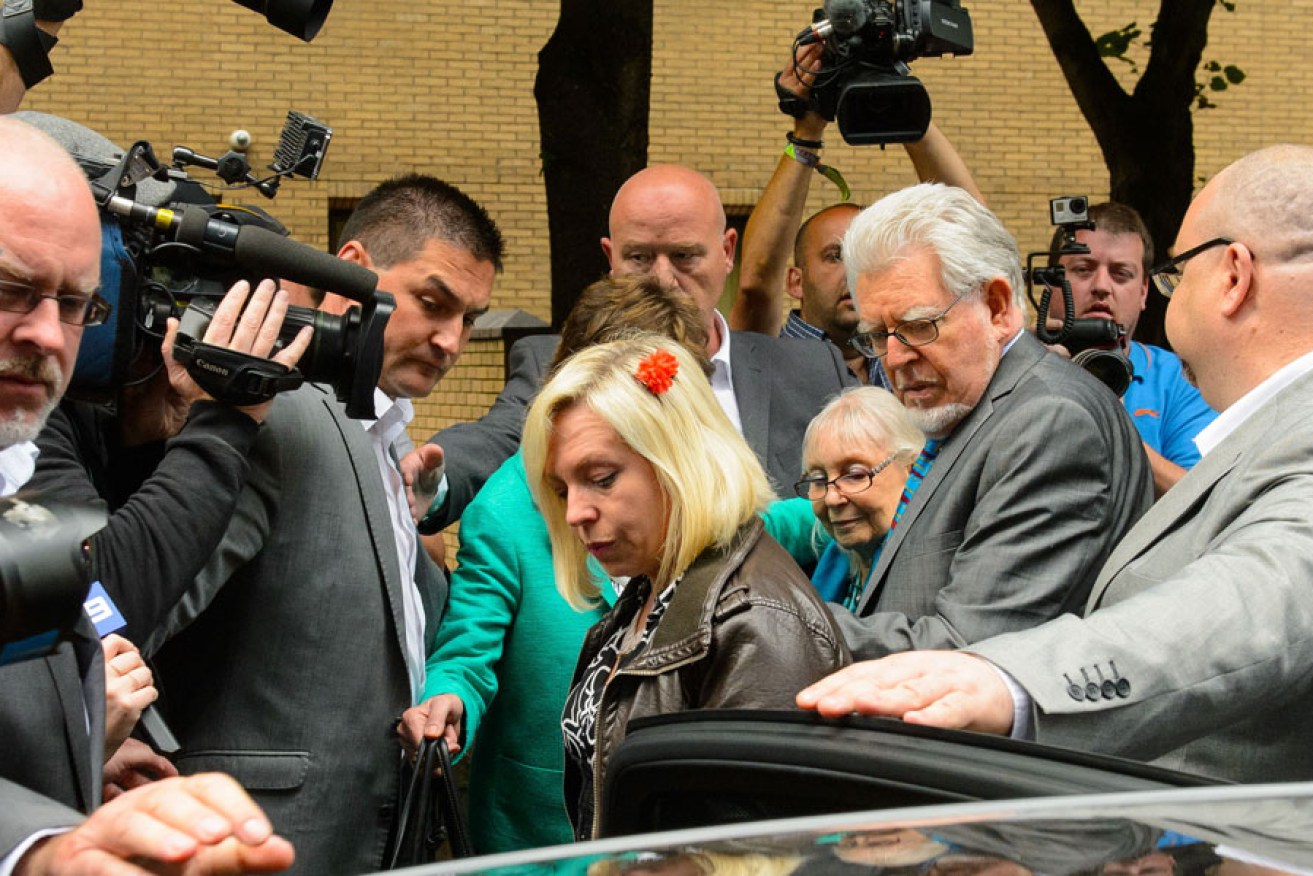Rolf Harris (right), his daughter and wife Alwen ) leave Southwark Crown Court in central London, after he was found guilty of 12 sex charges.