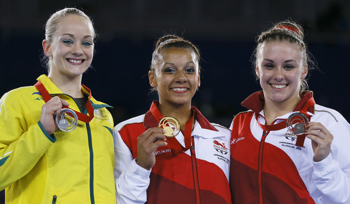 Silver medal winner Larrissa Miller with Rebecca Downie and Ruby Harrold of England. Photo: AP