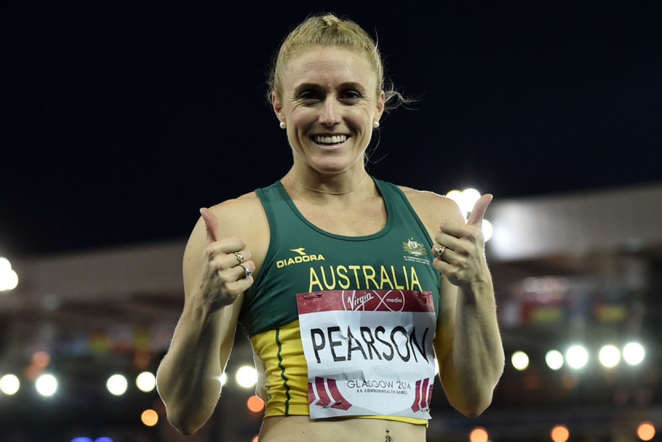 Sally Pearson gives a thumbs-up after winning her heat of the women's 100m hurdles. Photo: AAP