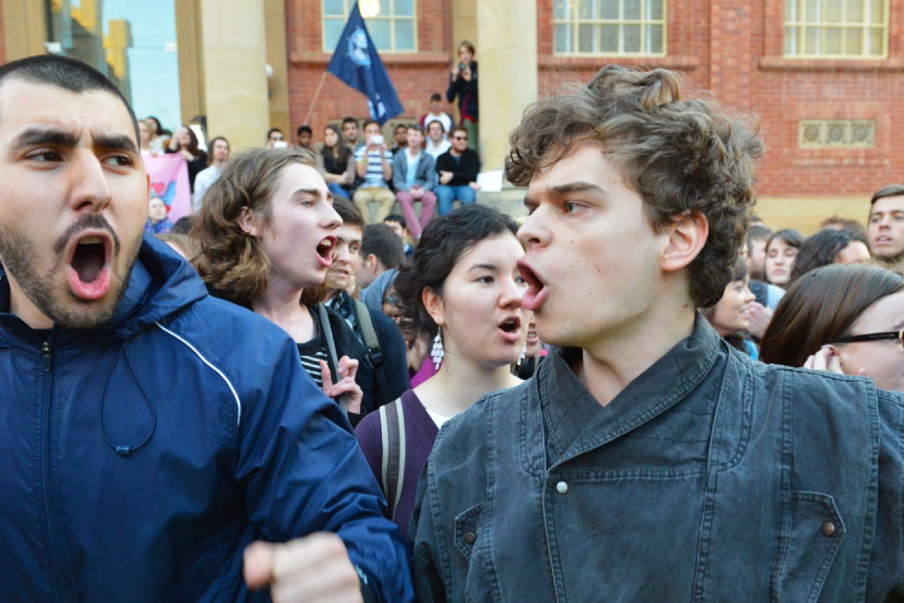 Protesters outside Tony Abbott's engagement at the University of Adelaide last night. AAP photo