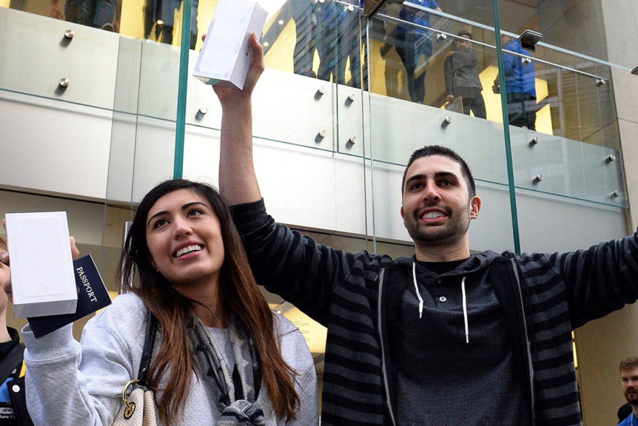 Buyers with their new IPhone 6. Photo: AAP