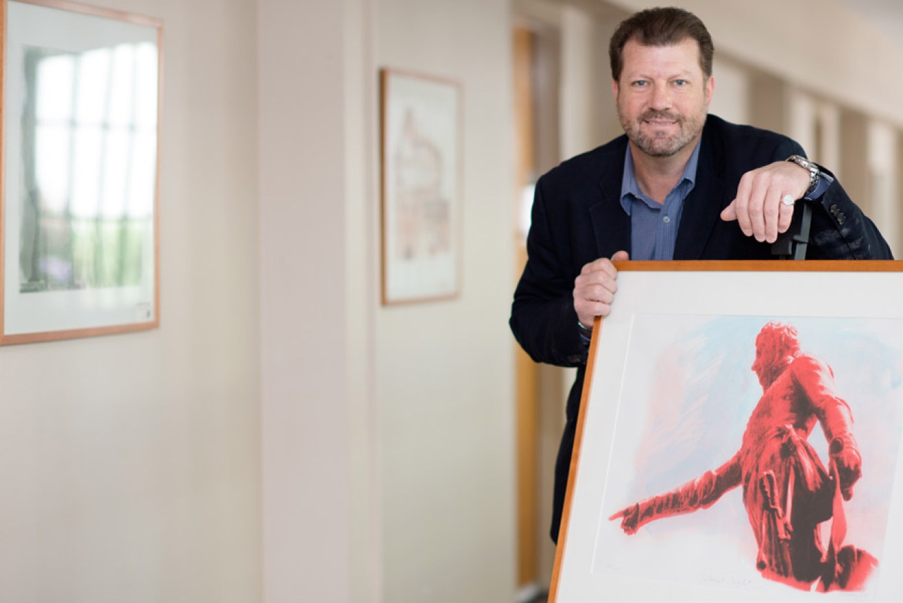Jonathon Rice with a Colonel Light lithograph. Photo: Nat Rogers/InDaily