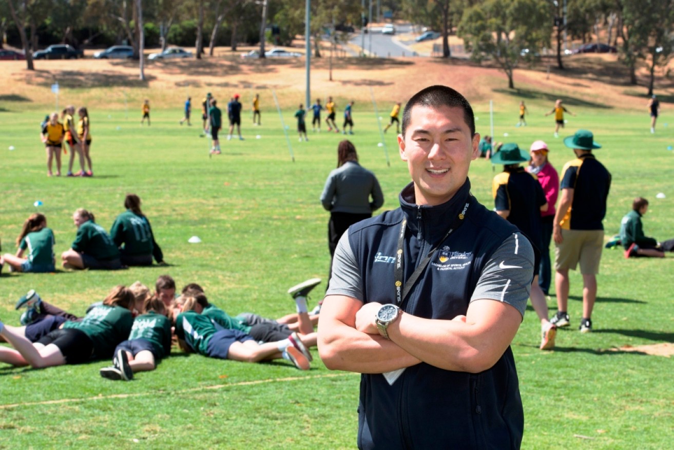 Dr Sam Elliott has been assessing Flinders Physical Education students' event management skills as they host 300 local primary school children at a footy carnival on campus. 