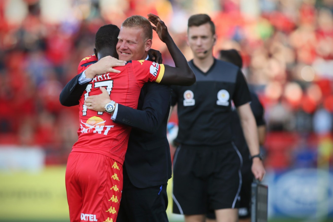 Awer Mabil is congratulated by coach Josep Gombau after scoring against Perth Glory