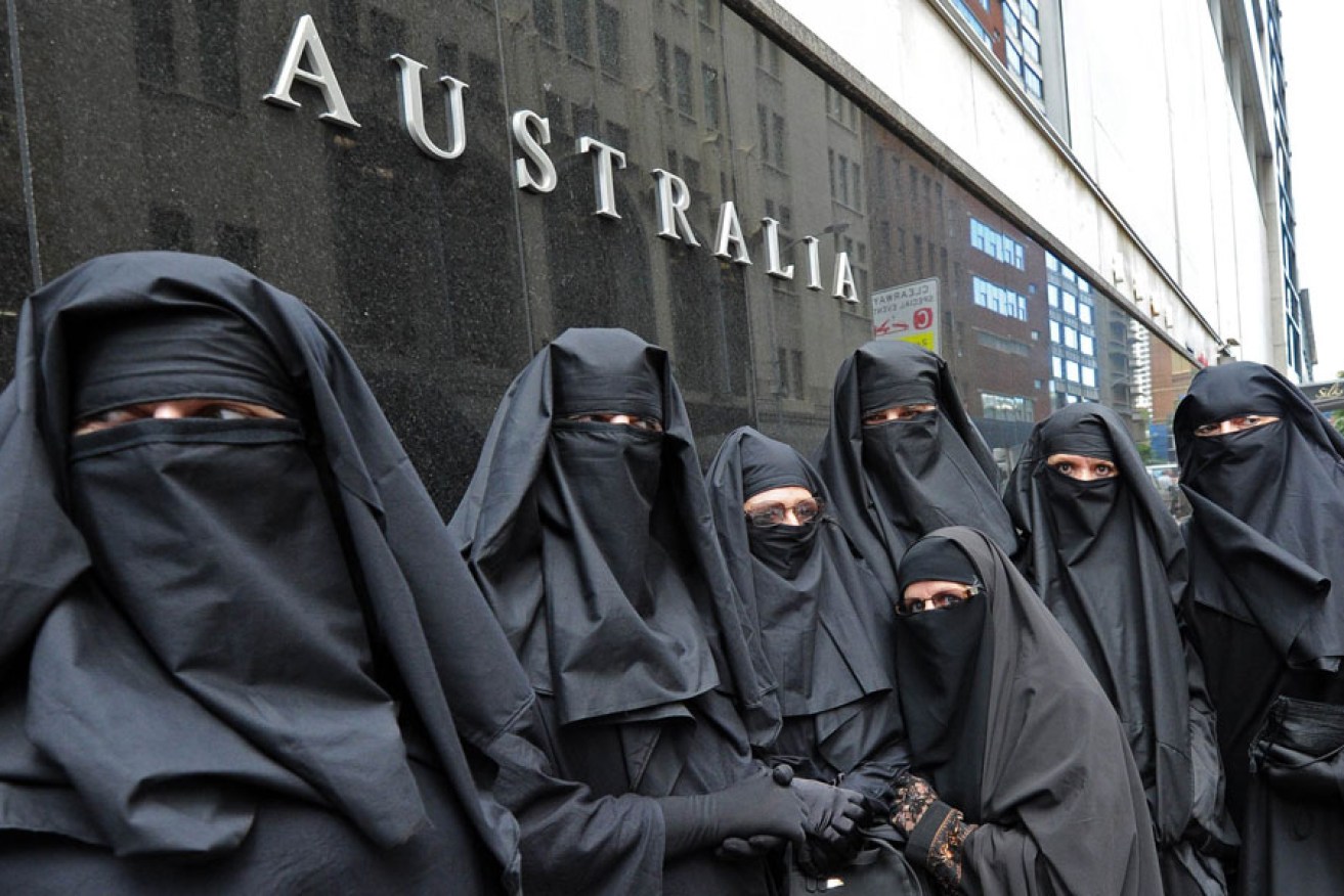 Men and women from the group Faceless call for the banning of the burqa at a rally in Sydney in 2012.