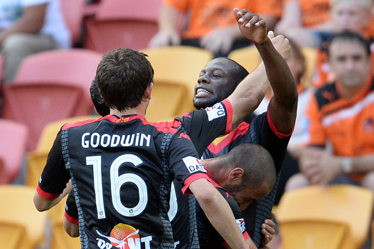 Adelaide's Bruce Djite celebrates his goal.