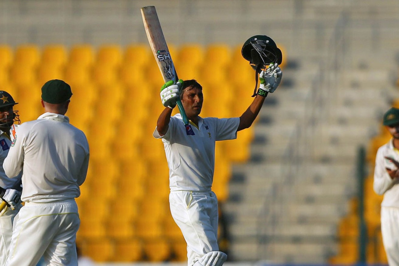 Pakistani batsman Younis Khan celebrates his third straight century against the Australians.
