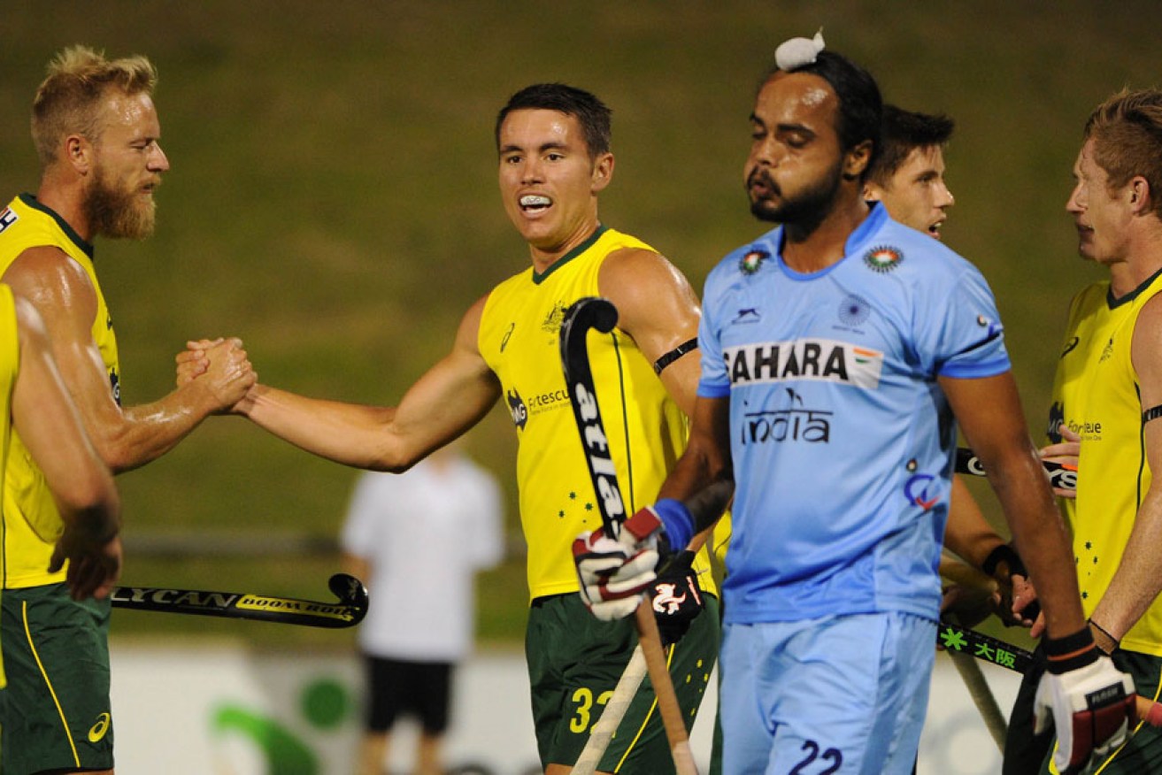 Jeremy Hayward (C) of Australia celebrates after scoring the first goal in the opening Test against India.