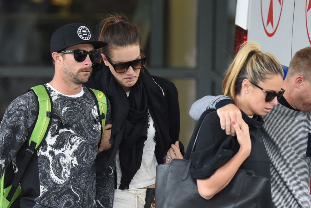 Cricketer Dave Warner his partner Candice Falzon (right) and Matthew Wade and his partner leave St. Vincents Hospital.