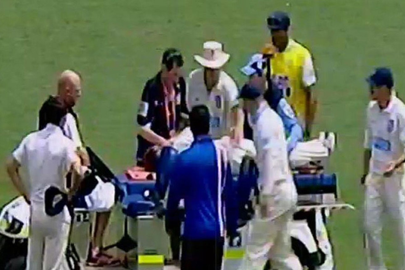 Phil Hughes was treated on the field after being struck by a bouncer. 
