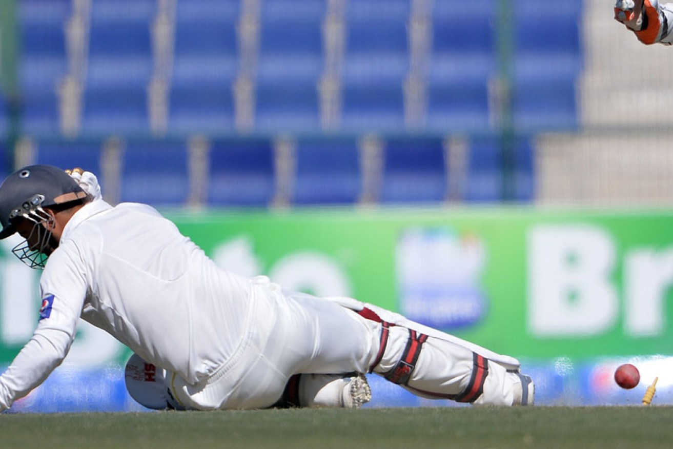 Ahmed Shahzad falls after hitting his wicket and being dismissed for 176 runs.